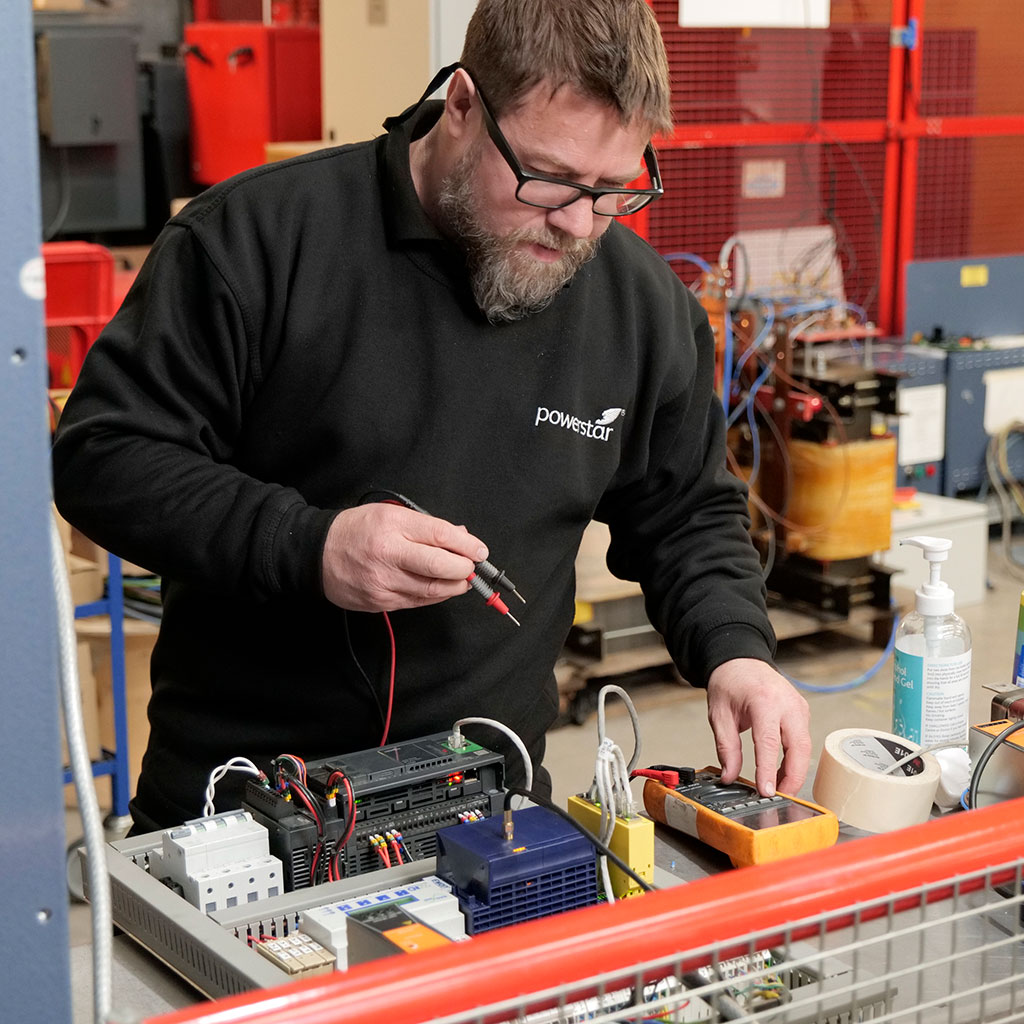 Engineer servicing a machine at Powerstar facility.
